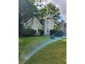 Charming two-story home featuring a lush front yard and brick chimney at 76 Burbank Dr, Atlanta, GA 30314