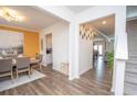 Bright foyer with hardwood floors leads to a dining room and the stairway to the second floor at 2718 Serena Way, Atlanta, GA 30331