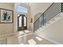 The foyer has wood floors, a staircase with black rails, and a double front door at 2989 Waterford Dr, Conyers, GA 30094