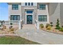 A double front door makes an elegant entrance to this stone and brick home at 2989 Waterford Dr, Conyers, GA 30094