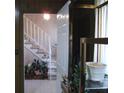 Inviting entryway featuring a staircase with carpeted steps and a view into a decorated living space at 2795 Dodson Lee Dr, East Point, GA 30344