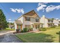 View of a quaint two-story home with well-kept lawn and driveway at 982 Hunt Rd, Jonesboro, GA 30236