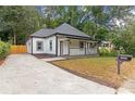 Inviting exterior showcasing a well-maintained lawn and a convenient driveway at 1055 Mayson Turner Nw Rd, Atlanta, GA 30314