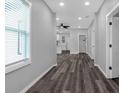 Bright hallway with stylish dark wood-look flooring and freshly painted walls at 1055 Mayson Turner Nw Rd, Atlanta, GA 30314