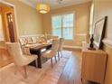 Elegant dining room featuring hardwood floors, decorative lighting, and a well-appointed table setting at 2080 Village Station Xing, Smyrna, GA 30080