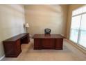 Home office featuring neutral walls, carpet, and large windows for ample natural light at 4055 Vista Point Ln, Suwanee, GA 30024