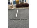 Two assigned parking spaces in front of the unit create ease of access for residents at 211 Buckland Dr, Alpharetta, GA 30022