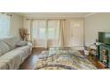Bright living room featuring hardwood floors and neutral walls at 646 Quillian Ave, Decatur, GA 30032