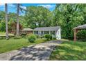 Charming ranch-style home with a private driveway surrounded by mature trees at 2210 Polar Rock Sw Ave, Atlanta, GA 30315