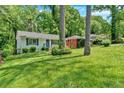 Well-kept single-story home with inviting curb appeal and lush greenery at 2210 Polar Rock Sw Ave, Atlanta, GA 30315