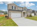 Charming two-story home with a brick facade and a two-car garage, plus a nicely manicured front yard at 6905 Winchester Pl, Fairburn, GA 30213