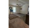 Comfortable living room with carpet, fan, and natural light at 144 Wiley Dr, Douglasville, GA 30134