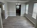 Dining room with hardwood floors, wainscoting, large windows, and chandelier at 3702 Gray Birch Dr, Decatur, GA 30034