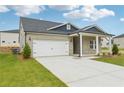 Attractive single Gathering home featuring light brick, white trim, and an attached two car garage at 6908 Winchester Pl, Fairburn, GA 30213