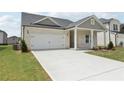 Attractive single-story home with a spacious driveway and a well-maintained lawn at 7760 Sheffield Ter, Fairburn, GA 30213