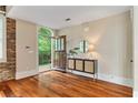 Inviting foyer features hardwood floors, a modern console table, and an arched doorway at 1832 Gordon Ne Mnr, Atlanta, GA 30307