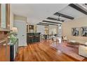 Spacious living room boasting hardwood floors, exposed beams, and an open floor plan at 1832 Gordon Ne Mnr, Atlanta, GA 30307