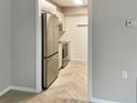 An updated kitchen with modern appliances, light gray cabinets, butcher block counters, and stylish flooring at 475 Mount Vernon Ne Hwy # 129C, Atlanta, GA 30328