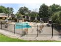 Community pool with lounge chairs and umbrellas, perfect for relaxation and recreation at 6906 Park Ave, Atlanta, GA 30342