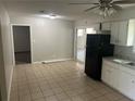 Functional kitchen featuring essential appliances, tiled floors, and ample space for dining at 8922 Gatewood Cir, Jonesboro, GA 30238