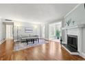 Bright living room with hardwood floors, fireplace, and large windows providing ample natural light at 516 Summit North Ne Dr, Atlanta, GA 30324
