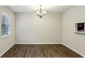 Dining area featuring wood floors, natural light, and a decorative chandelier at 3135 Reeves Se St, Smyrna, GA 30080