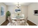 Bright dining area with modern table set and a view to the backyard at 3135 Reeves Se St, Smyrna, GA 30080