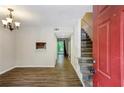 Inviting living room with wood flooring, staircase, and open layout at 3135 Reeves Se St, Smyrna, GA 30080