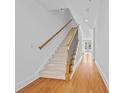 Staircase featuring carpeted stairs, hardwood floors, and wrought iron balusters at 2260 Edgartown Se Ln # 1, Smyrna, GA 30080