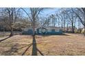 Cozy one-story home featuring a well-maintained lawn and a welcoming facade at 9588 Poston Rd, Jonesboro, GA 30238