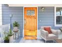 Cozy front porch featuring a wooden door, comfortable seating, and stylish accents at 1977 Nash Se Ave, Atlanta, GA 30316
