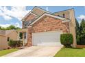 Beautiful brick house featuring a two-car garage and a neatly maintained lawn on a sunny day at 3845 New Salem Ct, Cumming, GA 30040