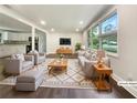 Bright and airy living room with stylish furniture and large windows at 4239 Canby Ln, Decatur, GA 30035