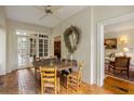 Bright dining area with brick floors, wood table, chairs, and access to the outdoors at 44 Muscogee Nw Ave, Atlanta, GA 30305