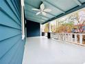 Spacious front porch with blue ceiling, white floors, and ceiling fan at 744 Oakland Se Ave, Atlanta, GA 30315