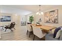 Charming living area flows into dining space, showcasing bright interiors and hardwood floors at 2117 Bucktrout Pl, Dunwoody, GA 30338