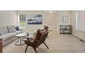 Inviting living room with large window and stylish decor, creating a warm and comfortable ambiance at 2117 Bucktrout Pl, Dunwoody, GA 30338