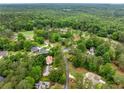 An aerial view showcases the home's neighborhood with lush greenery and mature trees at 4079 Essex Dr, Villa Rica, GA 30180