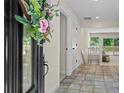 Inviting foyer with decorative tile flooring and a view to the bright living space with deck access at 4700 Township Walk, Marietta, GA 30066