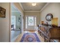 Inviting foyer with hardwood floors, a stylish rug, and decorative furniture at 116 Patrick Way, Marietta, GA 30064