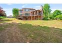 Expansive backyard with a two-level deck and patio, perfect for outdoor entertaining at 2400 Gants Hill Pl, Cumming, GA 30041