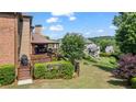 Inviting back deck with comfortable seating and a grill, ideal for enjoying the outdoors at 2400 Gants Hill Pl, Cumming, GA 30041