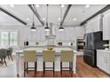 Modern kitchen with white cabinetry, stainless steel appliances, and a large center island with bar seating at 4884 Kentwood Dr, Marietta, GA 30068