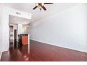 Bright living room features hardwood floors connecting to a stylish kitchen area at 361 17Th Nw St # 2407, Atlanta, GA 30363