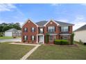 Well-kept brick home with landscaped yard and inviting entrance at 4699 Price St, Forest Park, GA 30297