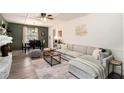 Cozy living room with a comfortable sectional, stylish decor, and an adjacent dining area at 3510 Spring Valley Blvd, Atlanta, GA 30349