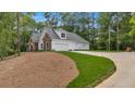 Beautiful home with a three car garage and long driveway in wooded setting at 11 Headden Nw Rdg, Cartersville, GA 30121