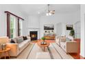 Bright living room with high ceilings, fireplace, and large windows providing natural light at 1544 Overview Cir, Lawrenceville, GA 30044