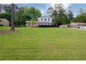 Two-story home on a large lot with lush green lawn at 3407 Larch Pine Dr, Duluth, GA 30096