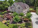 Stunning home with an attached garage and beautifully landscaped grounds at 6209 Benbrooke Dr, Acworth, GA 30101